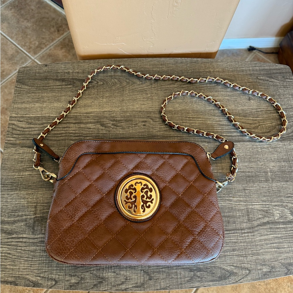 Brown crossbody handbag with gold floral tree metal pattern